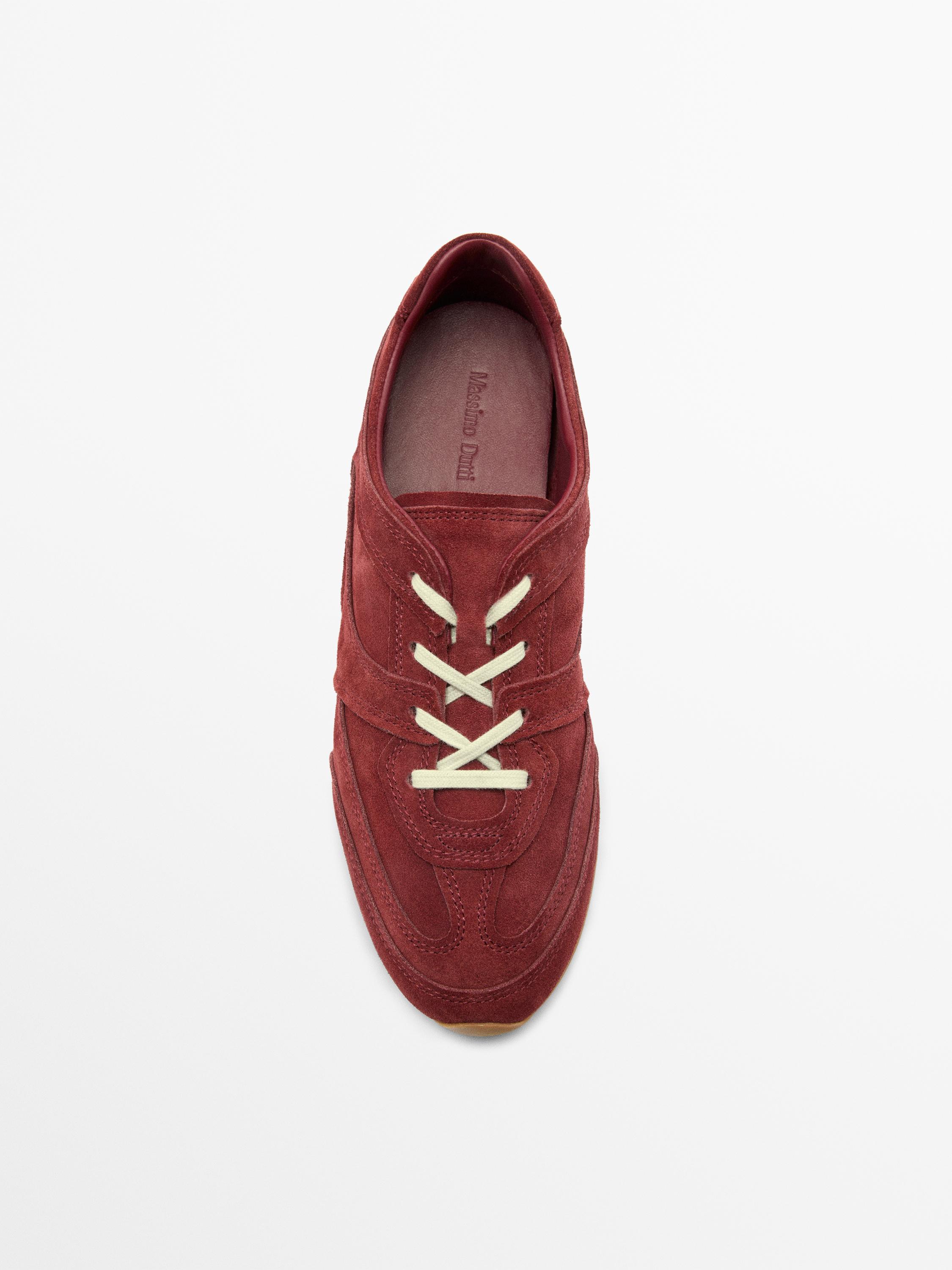 Split leather trainers with piece details